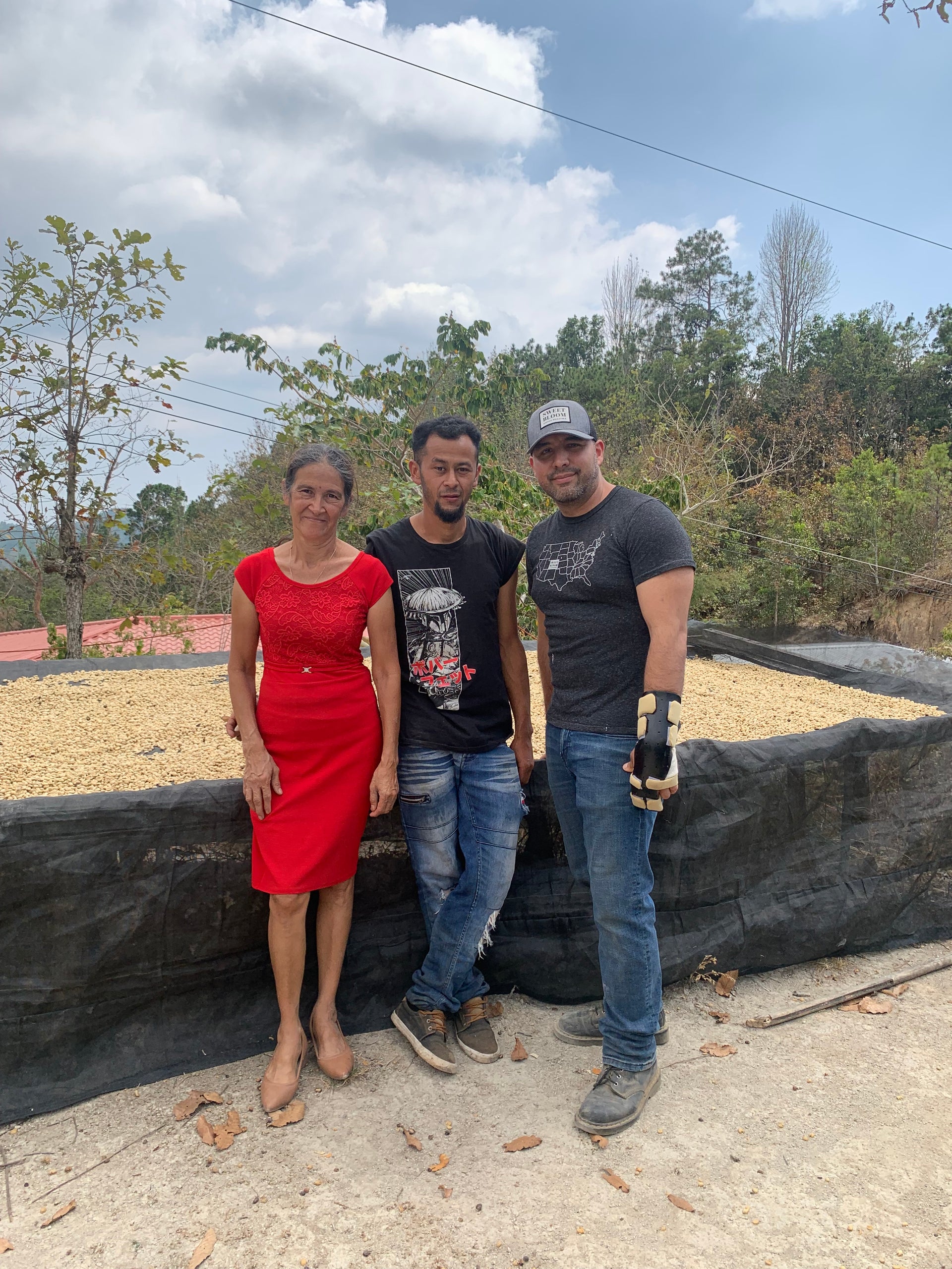 Nelson Flores, his mother Elsy and Miguel Vicuna from Sweet Bloom Coffee